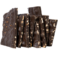 Load image into Gallery viewer, Close up of several pieces of bark candy stacked to expose the pistachios inside the dark chocolate.