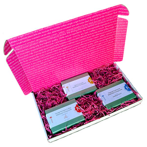 Open rectangle gift box lid up with view of  3 - 3oz green boxes of honeycomb with pink crinkle paper cushion between the boxes. 