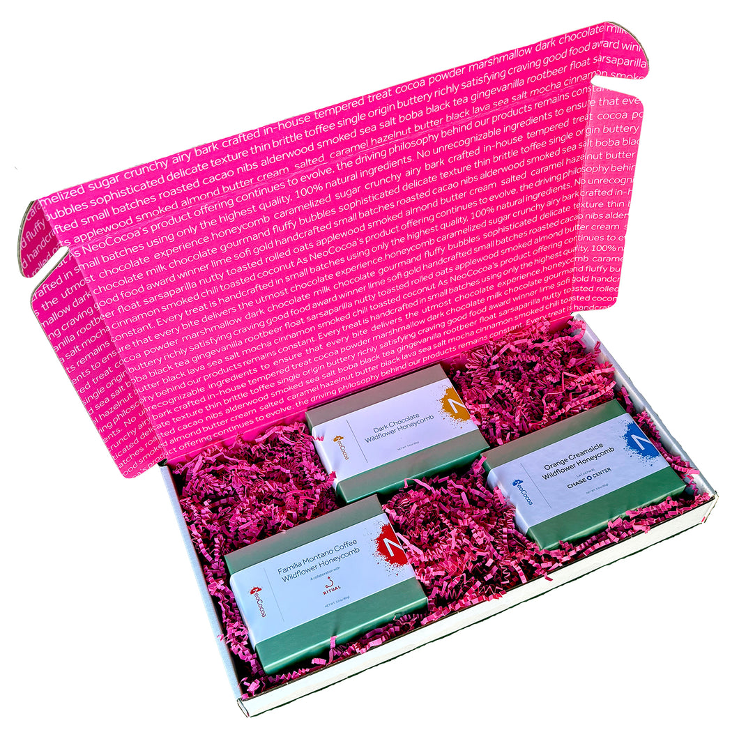 Open rectangle gift box lid up with view of  3 - 3oz green boxes of honeycomb with pink crinkle paper cushion between the boxes. 