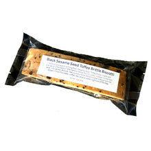 Load image into Gallery viewer, Clear bag with 2 pieces of sesame biscotti with a label stating &quot;Black Sesame Seed Toffee Brittle Biscotti&quot; 