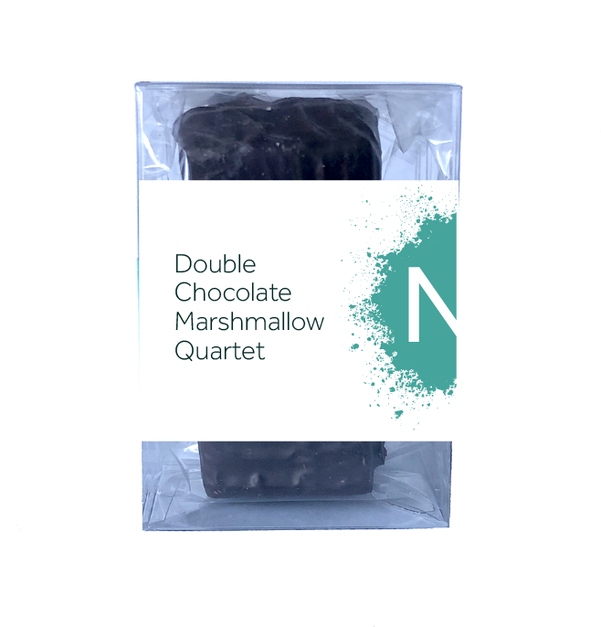 Front side of dark chocolate covered chocolate marshmallows in the clear bag inside of a clear plastic box, wrapped with a label stating “Double Chocolate Marshmallow Quartet” with blue NeoCocoa logo.