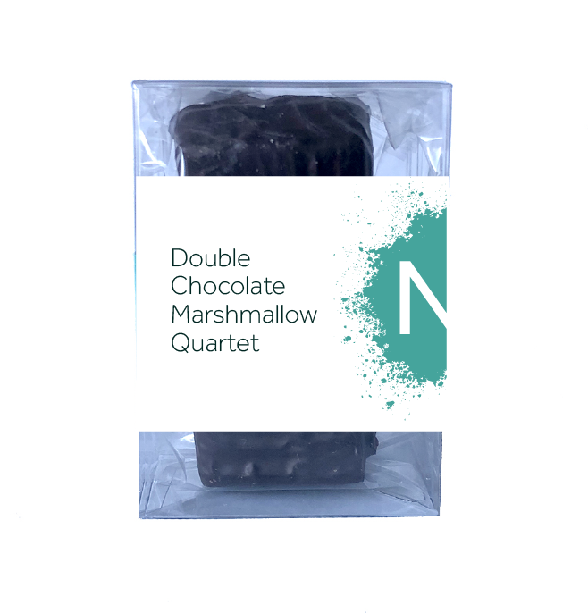 Front side of dark chocolate covered chocolate marshmallows in the clear bag in a clear box, wrapped with a label stating “Double Chocolate Marshmallow Quartet” and NeoCocoa logo.