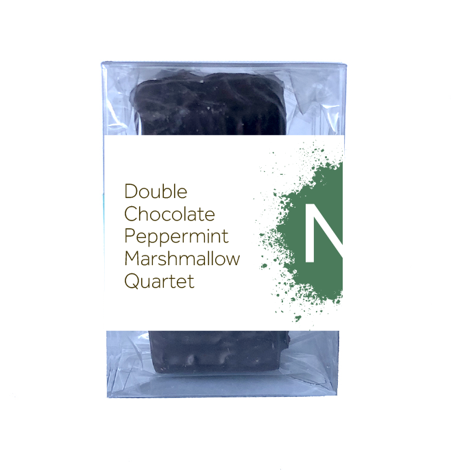 Front side of dark chocolate covered chocolate marshmallows in the clear bag in a clear box, wrapped with a label stating “Double Chocolate Peppermint Marshmallow Quartet” and NeoCocoa logo.