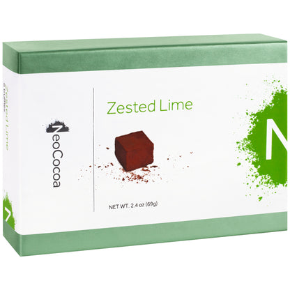 Closed 2 dimensional green rectangle box with a label wrapped around the center of the box stating, “Zested Lime” with NeoCocoa logo and net weight 2.4 oz (69g). With a single image of a lime truffle with a little bit of cocoa powder sprinkles. 