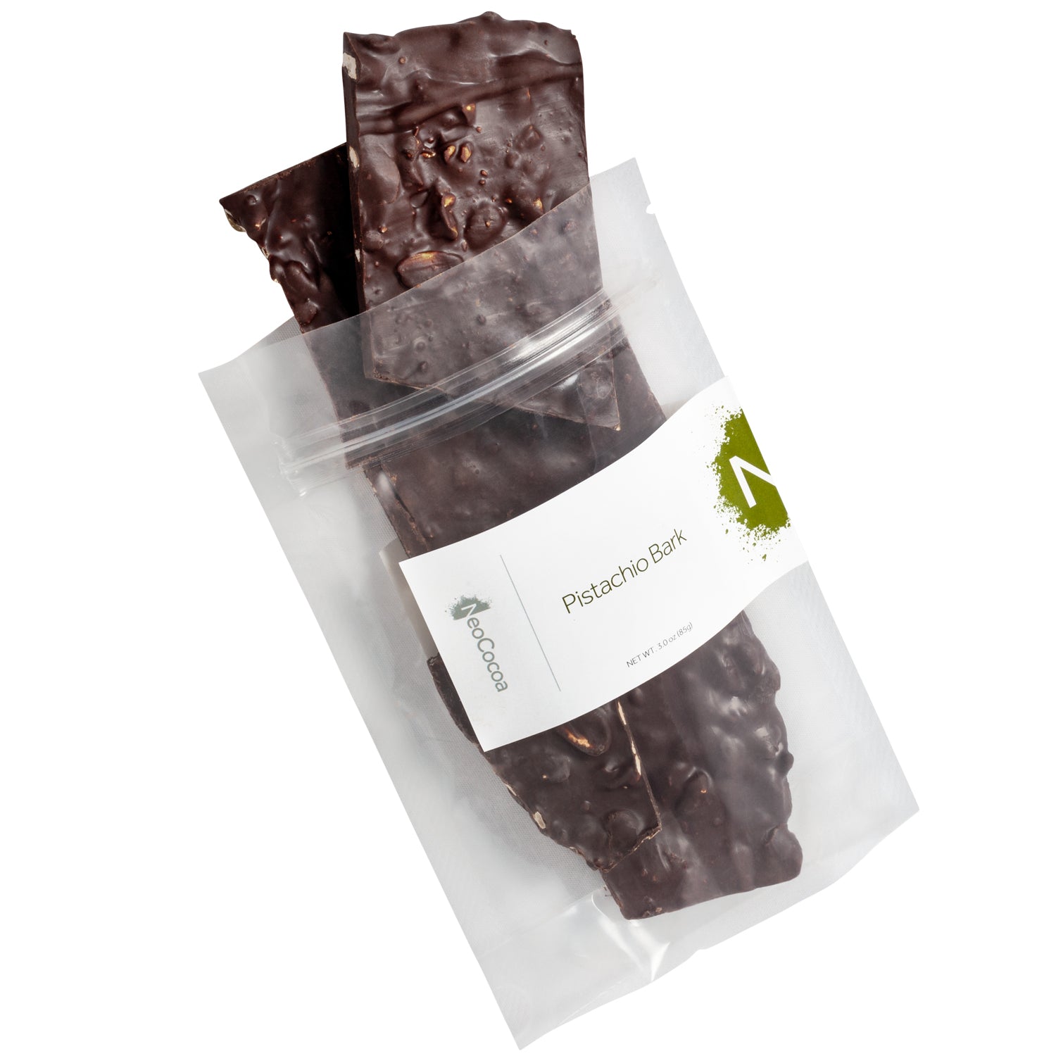Clear bag of 3oz (85g) dark chocolate pistachio bark pouring out of bag. Label states, “Pistachio Bark” with NeoCocoa logo.