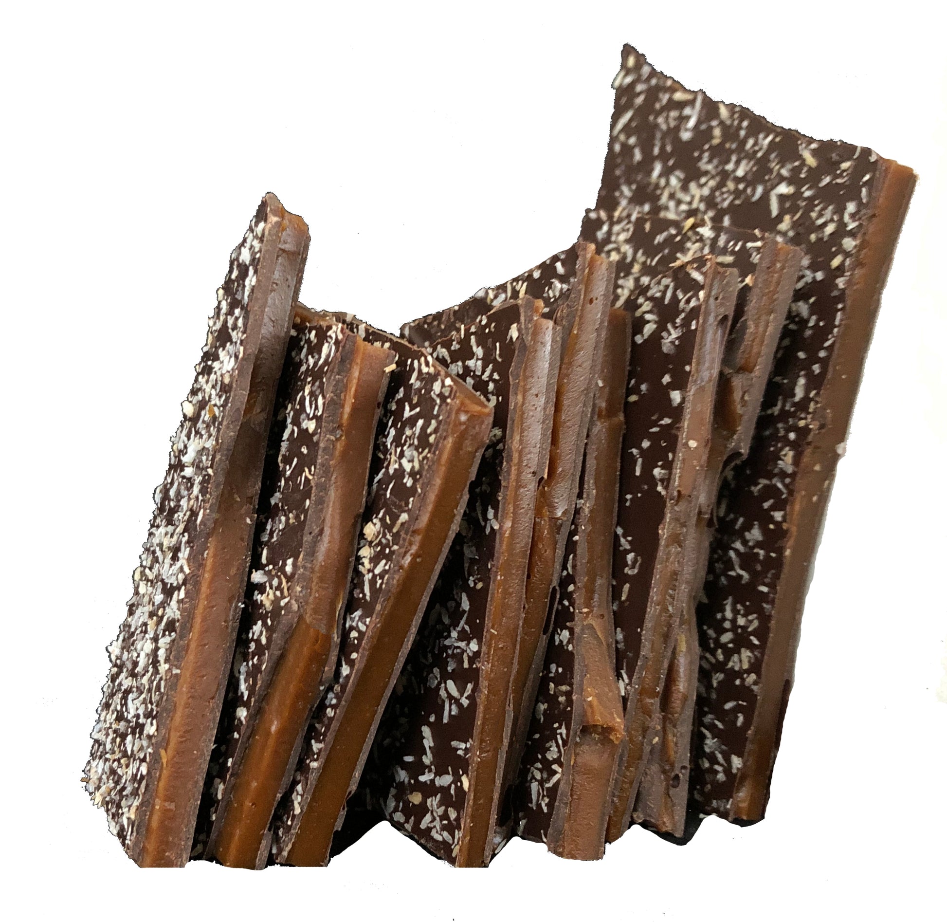 Close up of several pieces of toasted coconut brittle candy stacked.