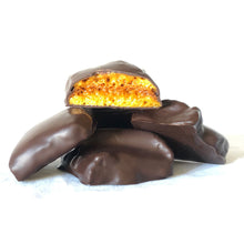 Load image into Gallery viewer, A 3oz pile of chocolate covered honeycomb candy pieces with one piece broken open to expose honeycomb candy inside.