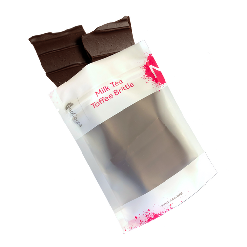 Milk Tea brittle pouring out of 3oz sized bag with label stating “Milk Tea Toffee Brittle” and NeoCocoa logo.