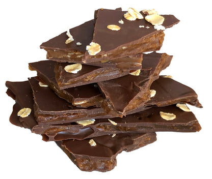 Close up of several pieces of oat brittle candy stacked.