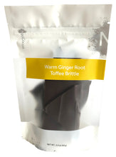 Load image into Gallery viewer, Ginger brittle closed, front 3oz sized bag with label stating “Warm Ginger Root Brittle” and NeoCocoa logo.